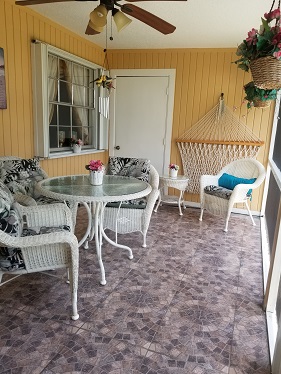 Large solid covered roof, screened and tiled patio.
Access from living area and two rooms from split floor plan